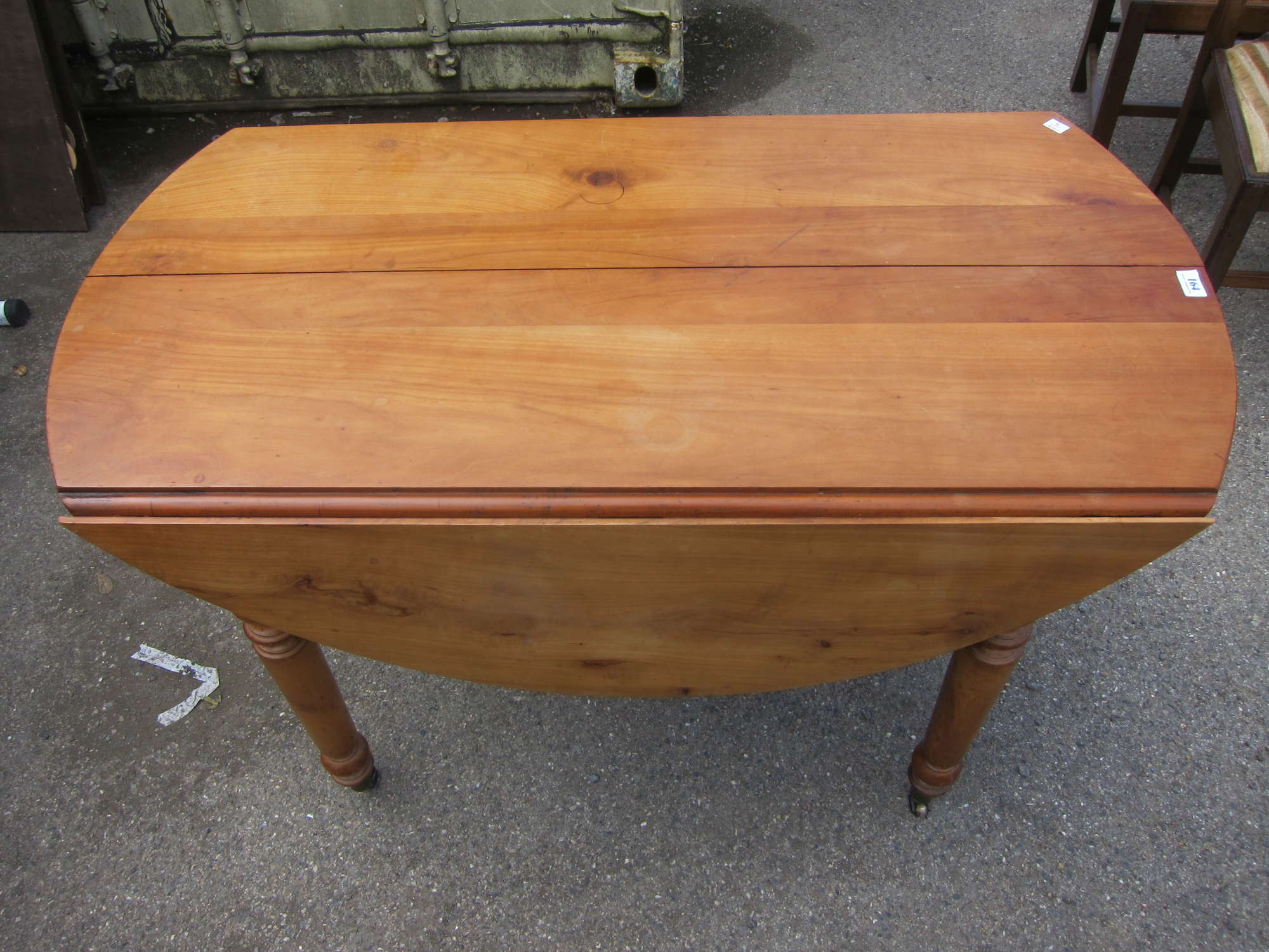 Appraisal: French walnut drop flap dining table on turned legs together