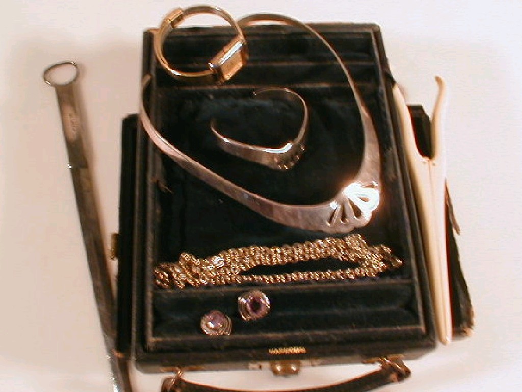 Appraisal: A Harrods leather travel case together with costume jewellery glove