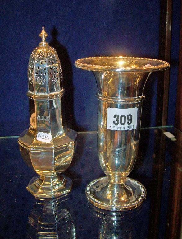 Appraisal: A silver trumpet shaped vase and a similar sugar castor