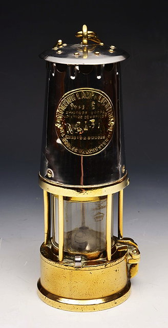 Appraisal: A BRASS AND PRESSED STEEL MINER'S LAMP the 'Protector' by