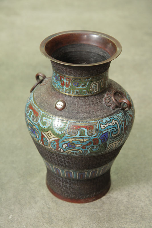 Appraisal: POLYCHROME CLOISONNE VASE With two ring handles Bronze with cloisonne