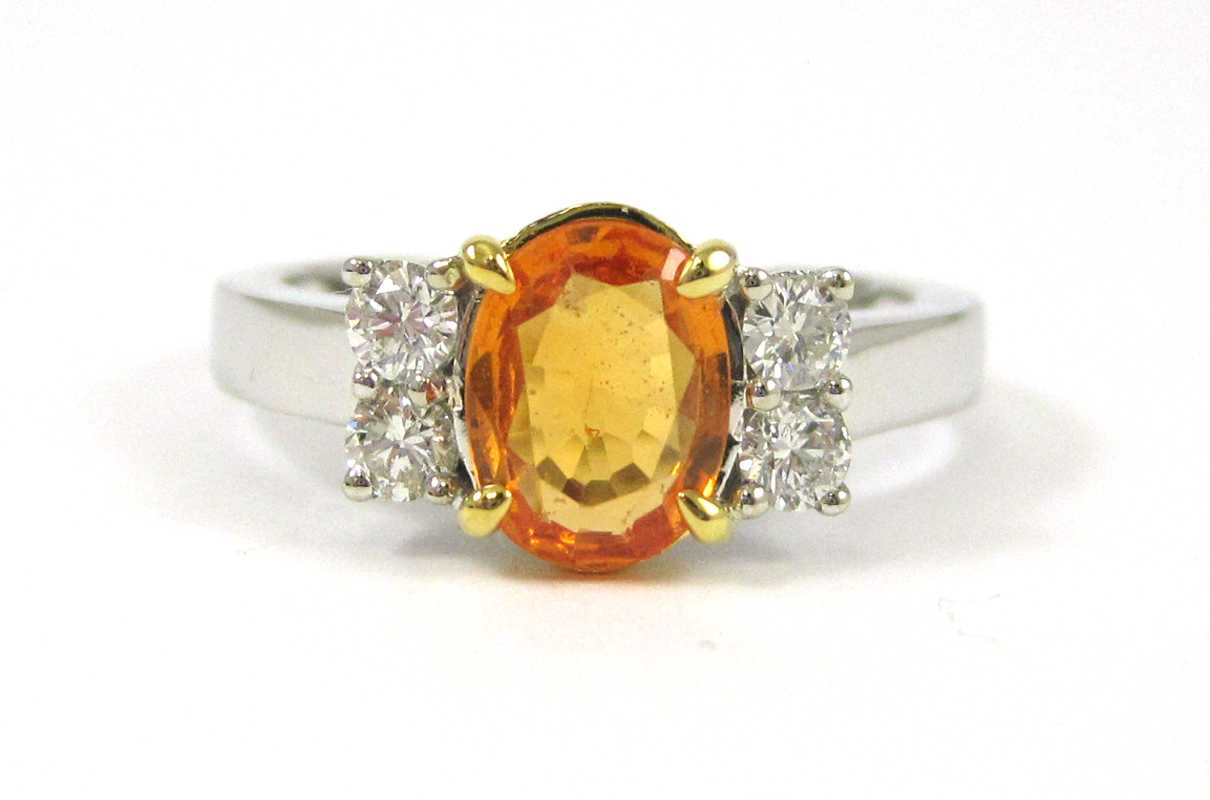 Appraisal: YELLOW SAPPHIRE AND FOURTEEN KARAT GOLD RING with AIGS gemstone