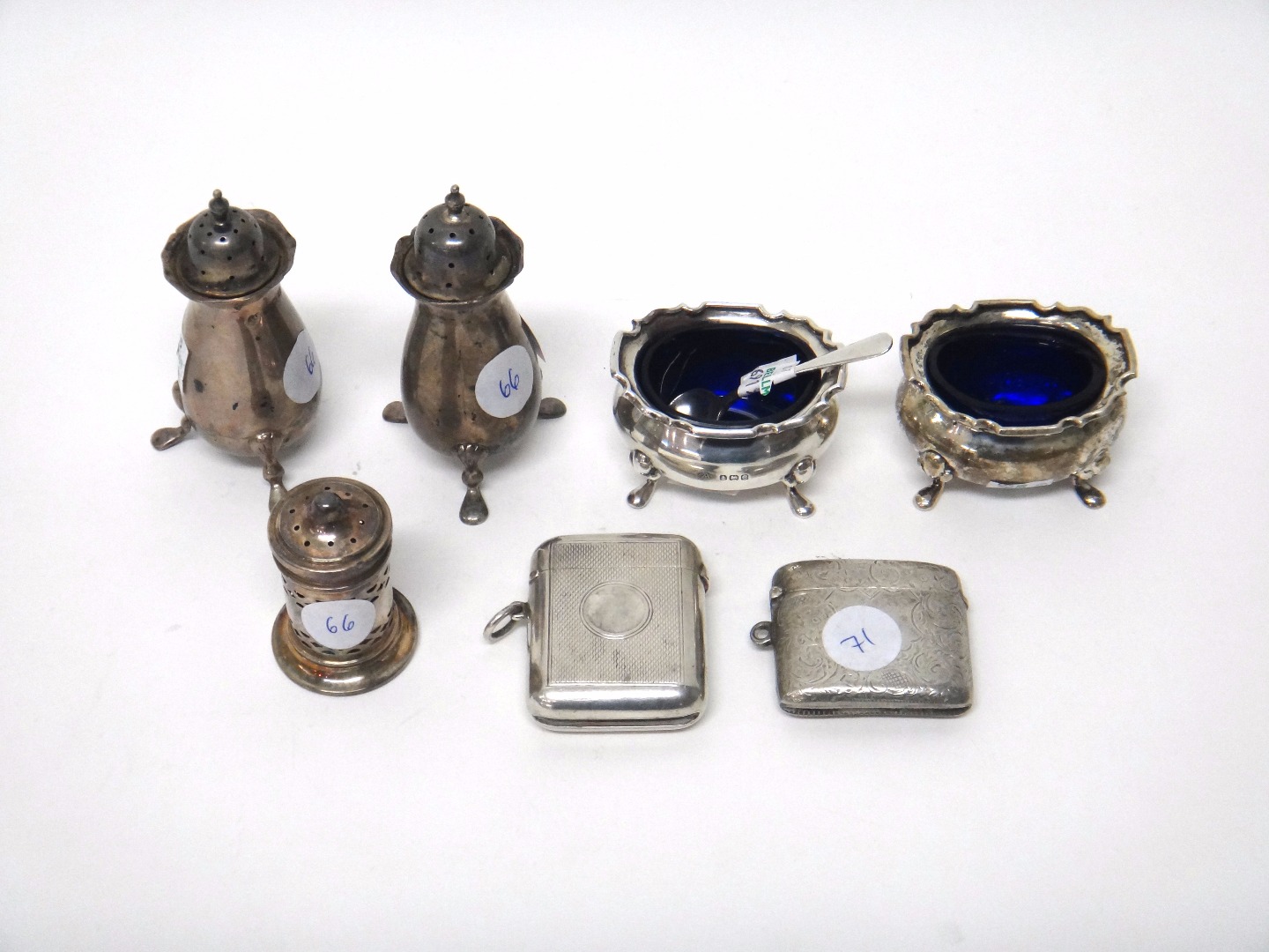 Appraisal: Silver comprising two baluster shaped pepperettes each raised on three