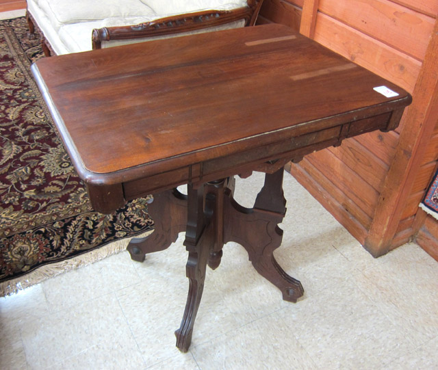 Appraisal: VICTORIAN WALNUT LAMP TABLE Eastlake design American c having a