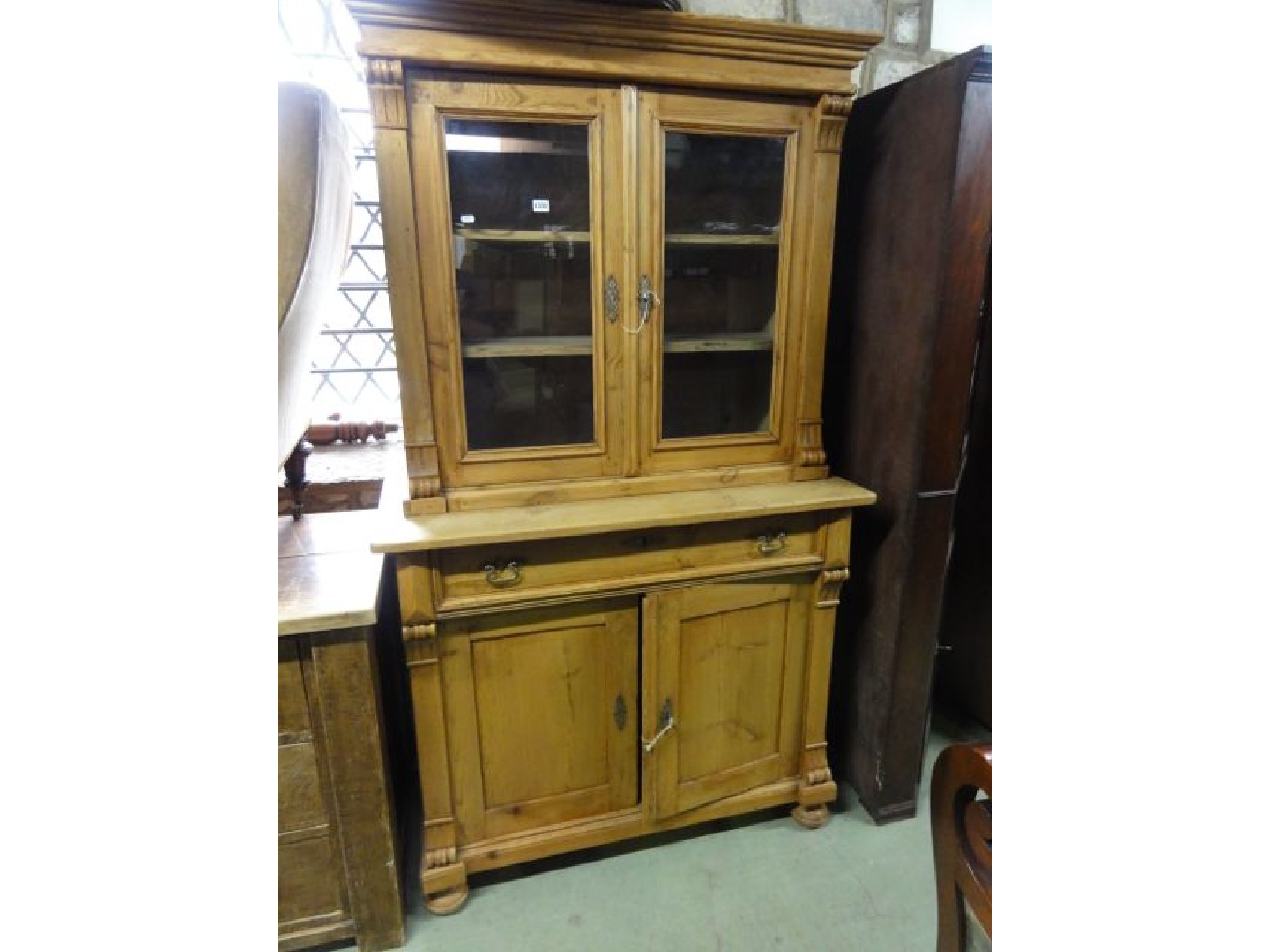 Appraisal: A th century stripped and waxed pine kitchen dresser the