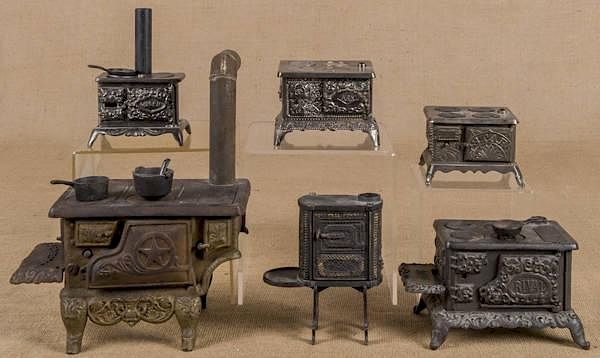 Appraisal: Three Kenton cast iron nickel and tin toy stove Three