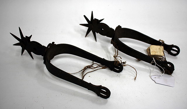 Appraisal: A PAIR OF OLD IRON SPURS cm long