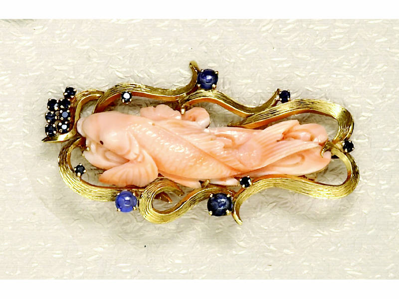 Appraisal: CORAL BROOCH k yellow gold carved coral brooch in the