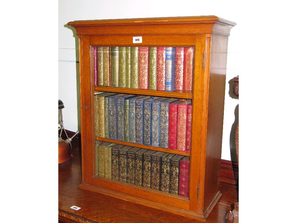 Appraisal: Oak glazed door bookcase with a quantity of books