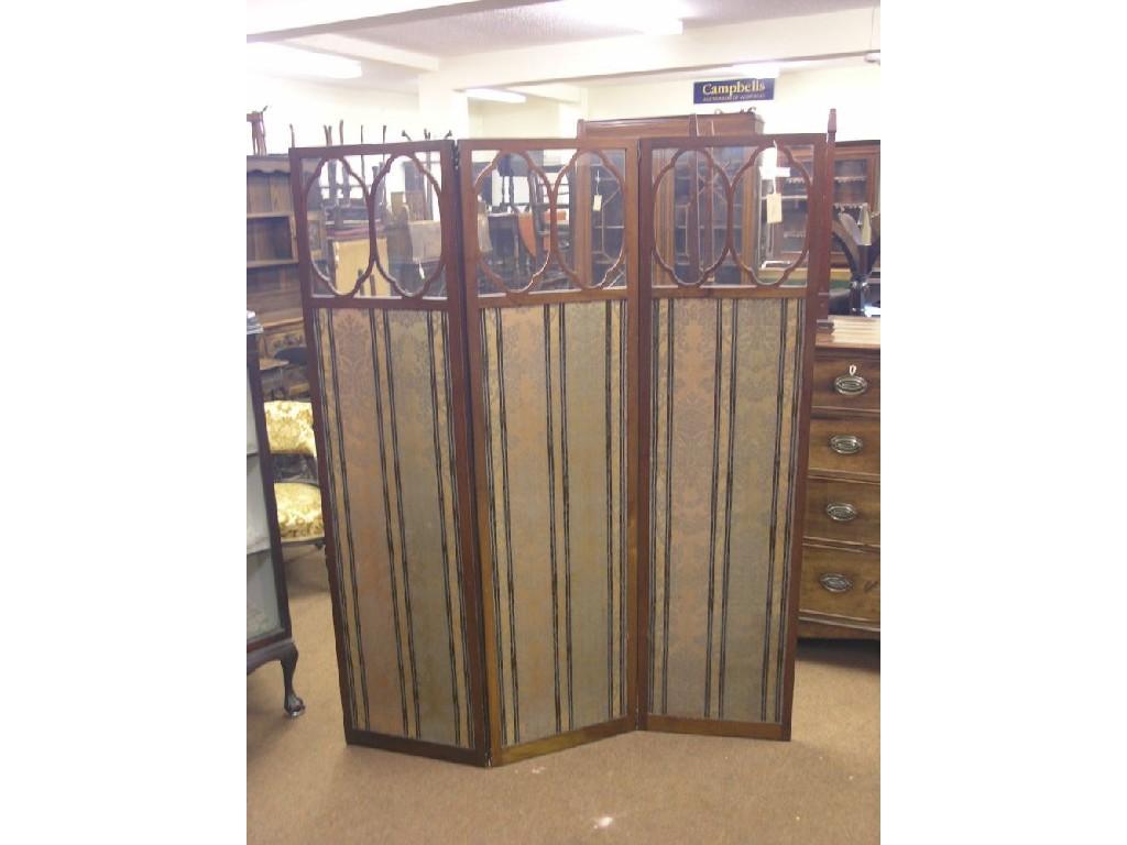 Appraisal: An early th century three-leaf dressing screen astragal-glazed panels above