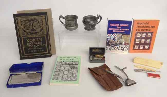 Appraisal: Lot including two silverplate mugs various razors and books on