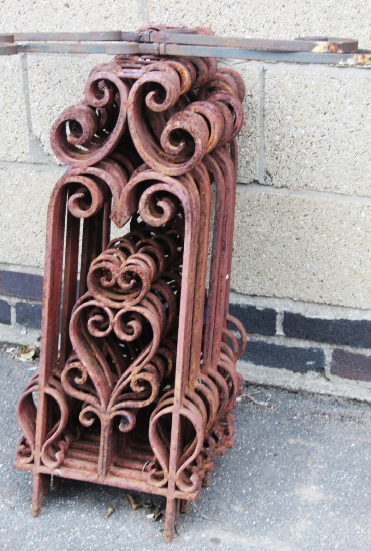 Appraisal: A set of cast iron stands or trellis each with