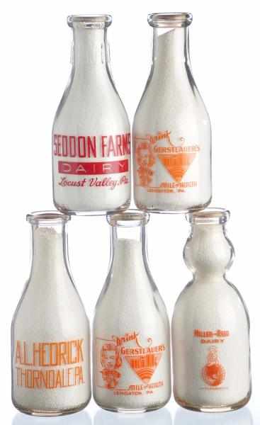 Appraisal: Lot of Pennsylvania Milk Bottles Description Lot includes two bottles