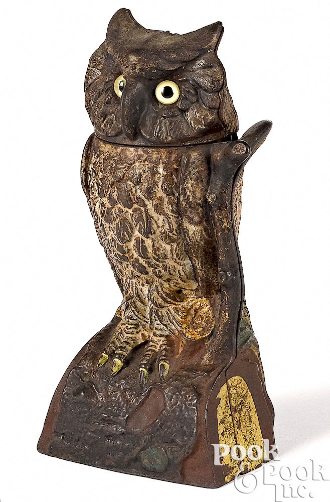 Appraisal: J E Stevens owl turns head mechanical bank J E