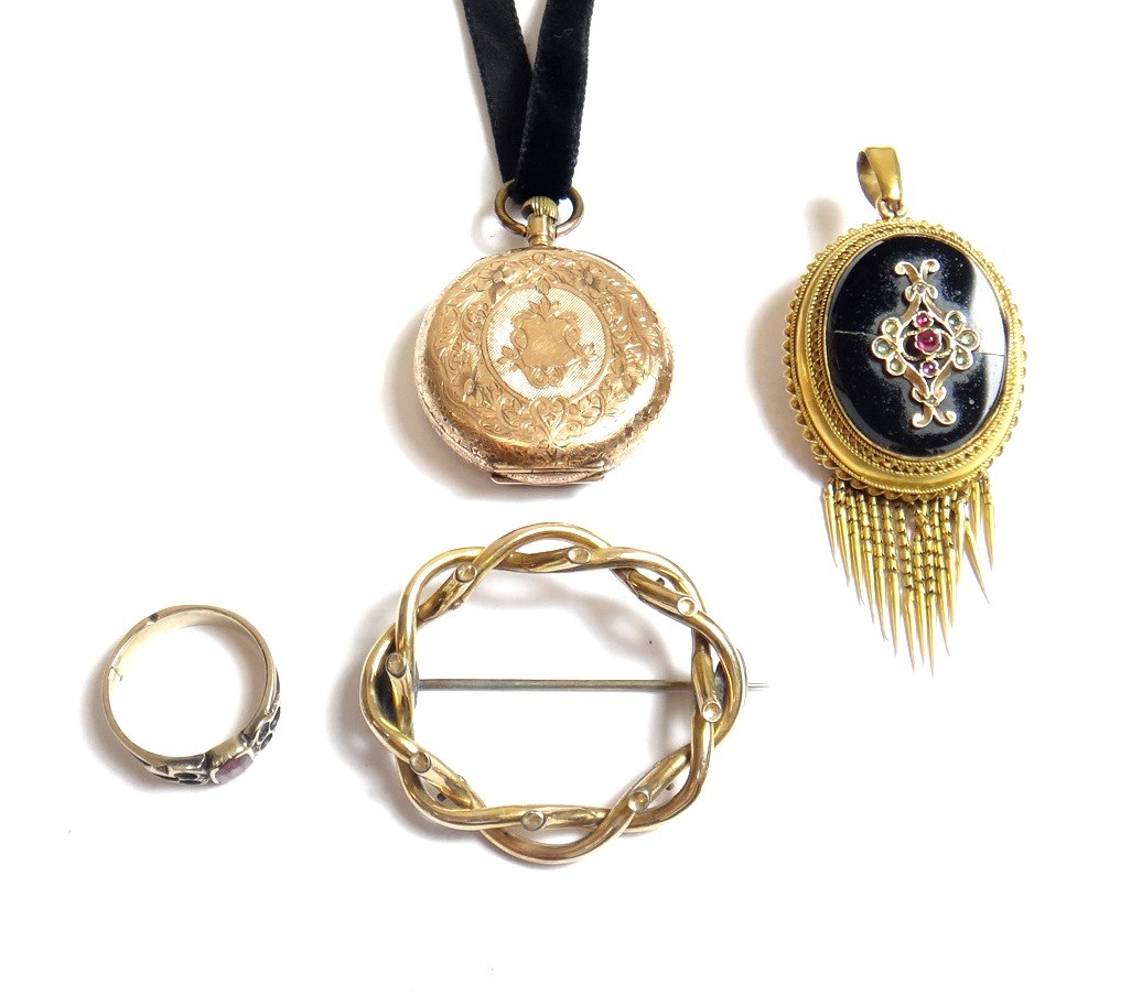 Appraisal: A Victorian gold black onyx and gem set oval pendant