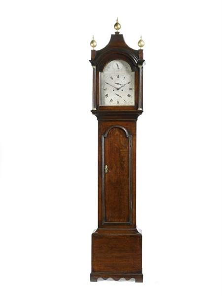 Appraisal: A George III oak longcase clock the twin train movement