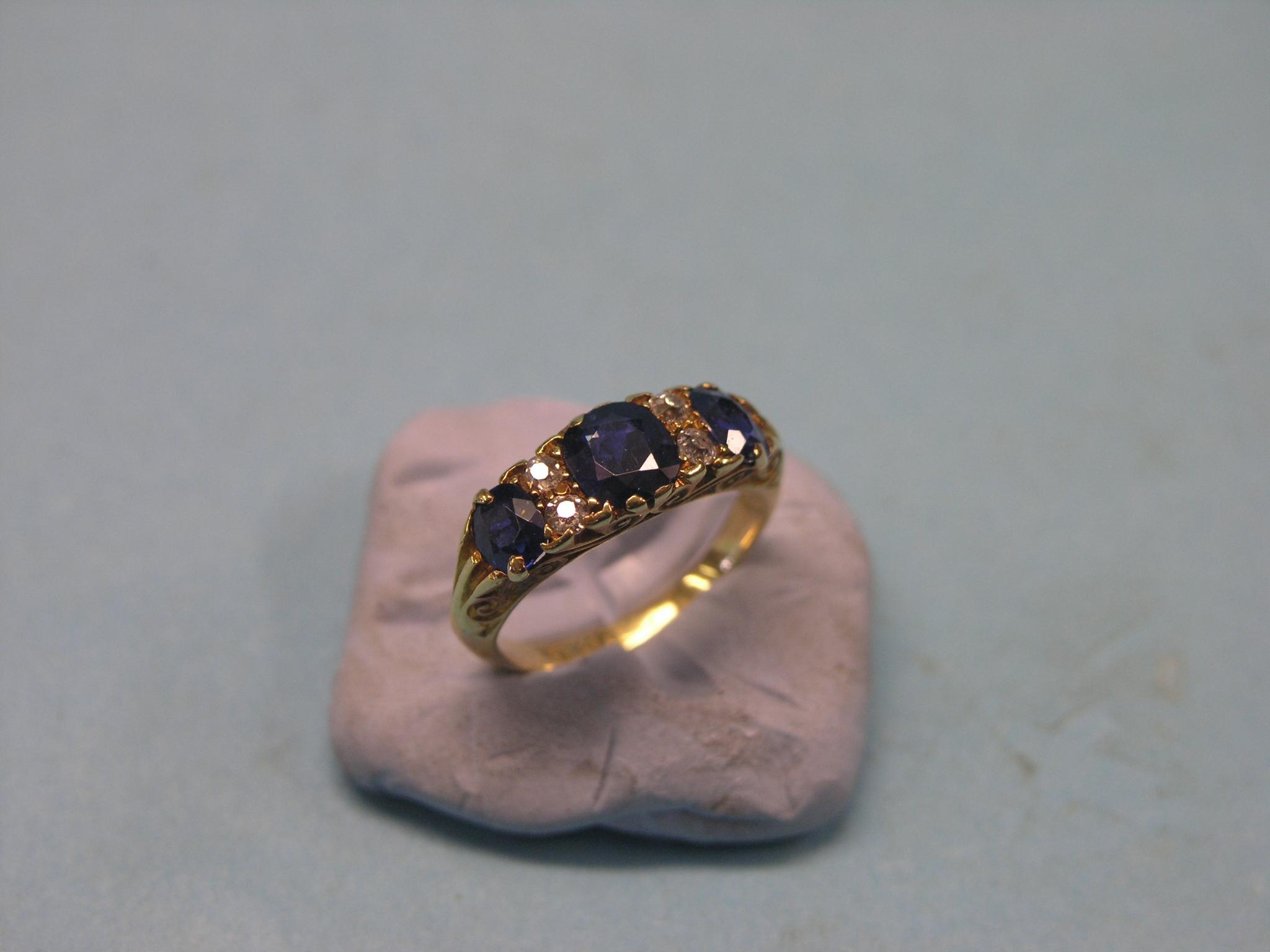 Appraisal: A late Victorian gold sapphire and diamond chip ring half-hoop