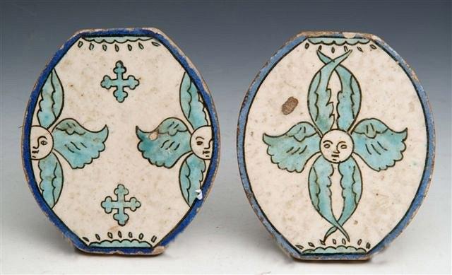 Appraisal: A PAIR OF TURKISH KUTAHYA POTTERY TILES with shaped oval