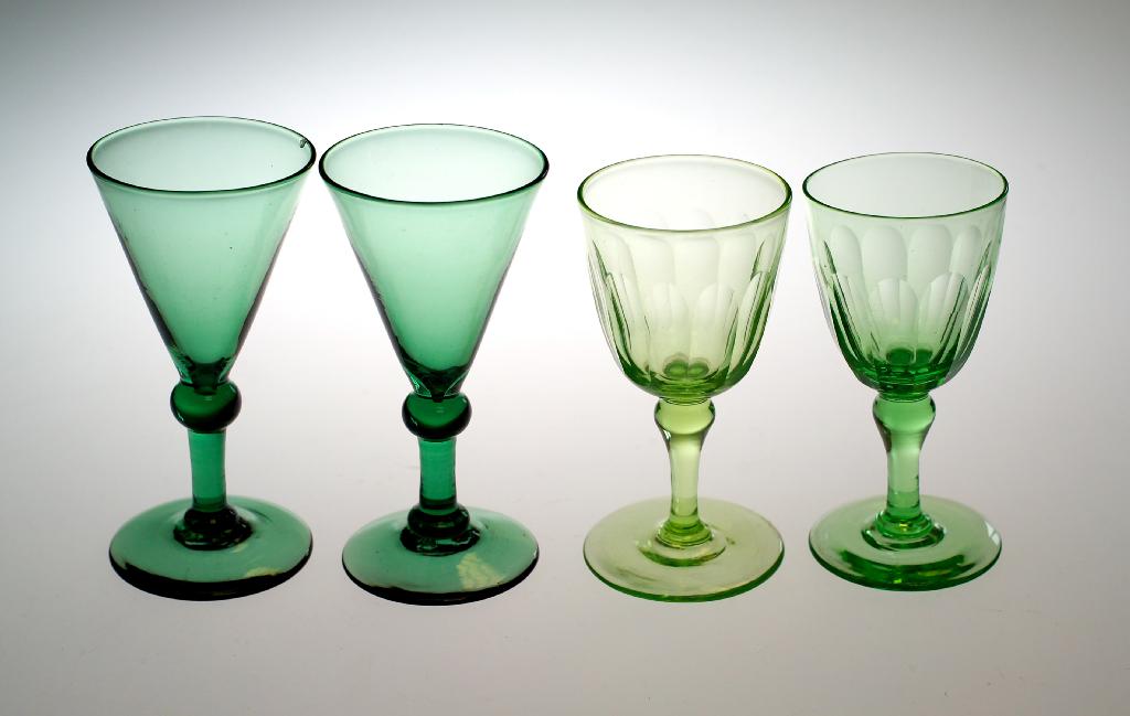 Appraisal: PAIR OF URANIUM GLASS WINES c each with panel cut