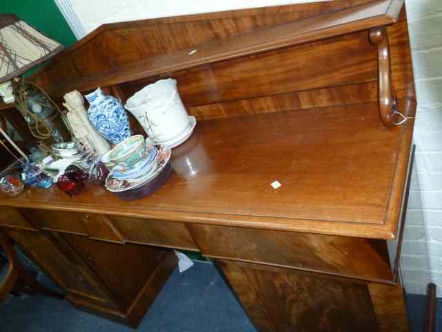 Appraisal: A VICTORIAN MAHOGANY PEDESTAL SIDEBOARD the raised back with single