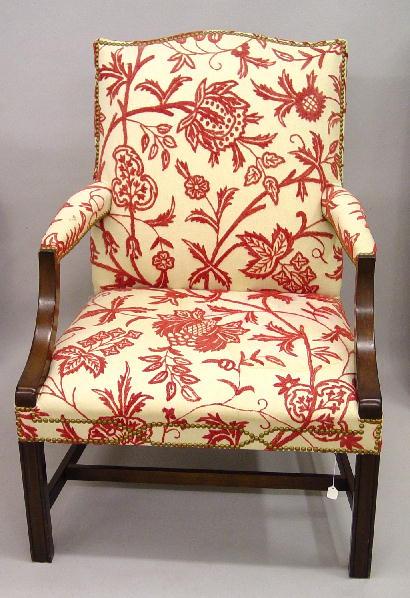 Appraisal: CHIPPENDALE-STYLE ARMCHAIR Twentieth century mahogany Molded legs with a stretcher