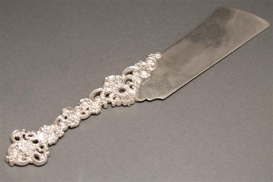 Appraisal: American Rococo style repousse silver reticulated serving knife Towle late