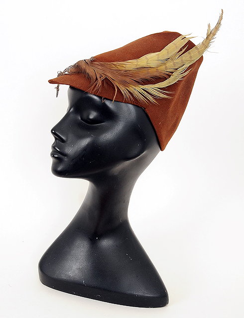 Appraisal: A late s brown tall cone shaped hat with pheasant