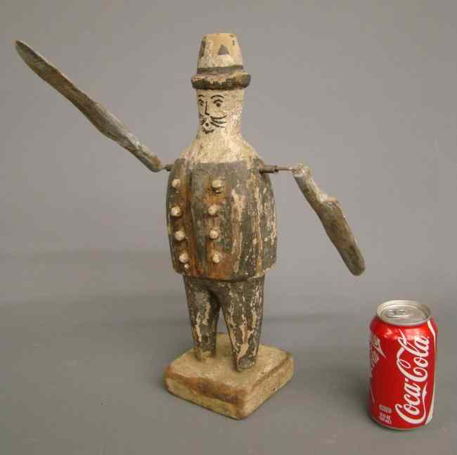 Appraisal: Folk art carved and painted whirligig of a man with