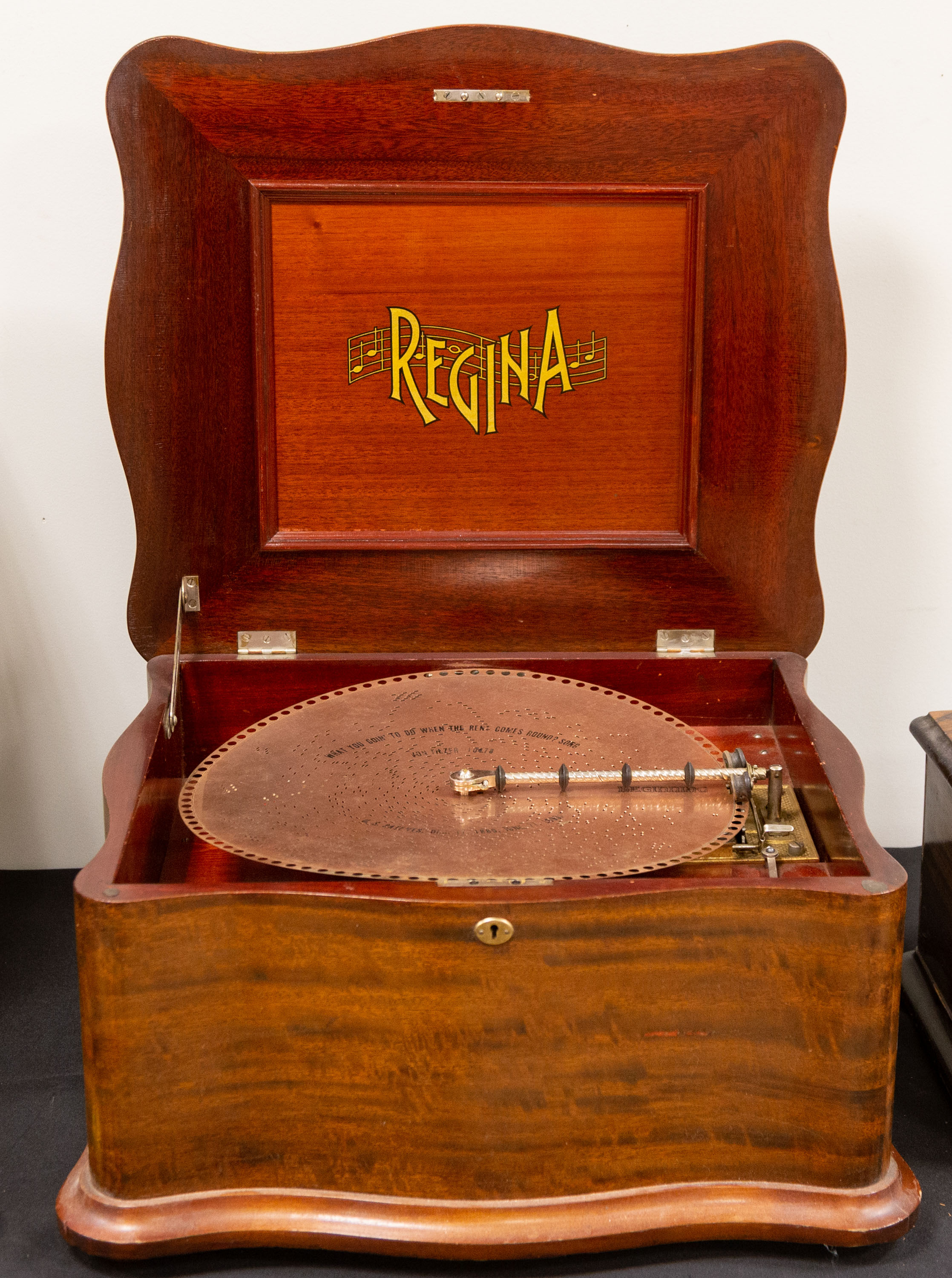 Appraisal: REGINA INCH DISK MUSIC BOX Mahogany case Comes with disks