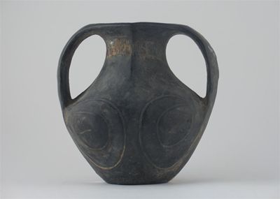 Appraisal: A Chinese Neolithic black pottery vase decorated with stylized scrolling