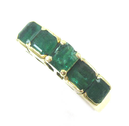 Appraisal: EMERALD AND FOURTEEN KARAT GOLD RING set with five emerald-cut