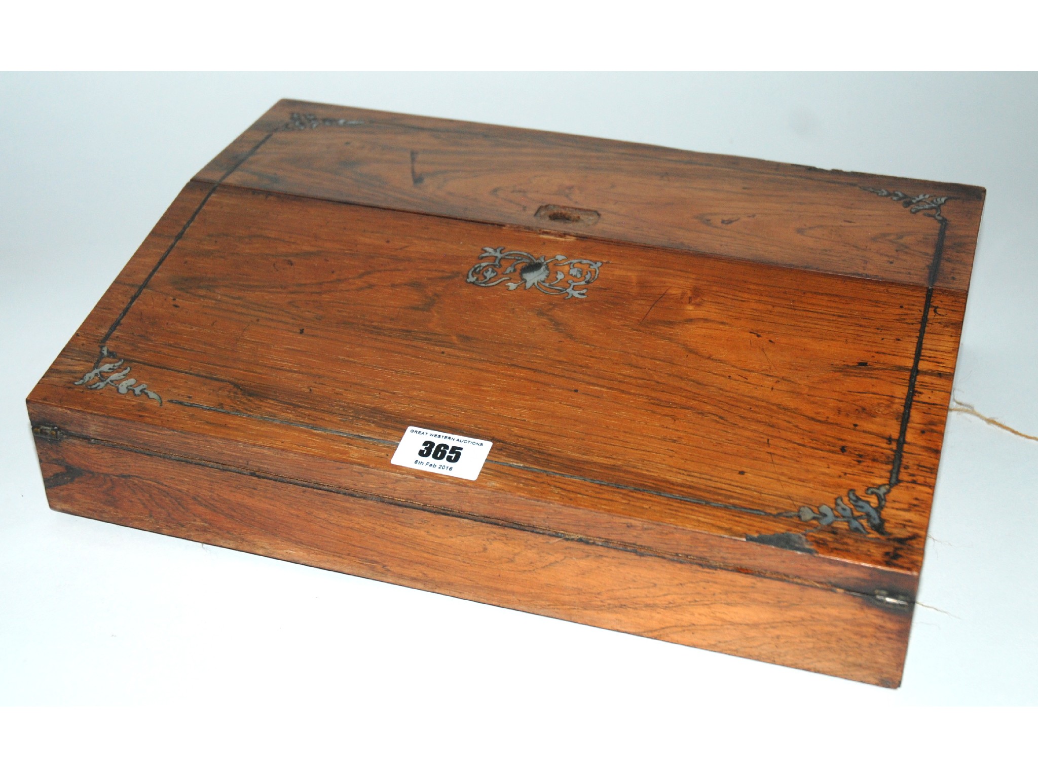 Appraisal: An oak and mother of pearl writing slope with inkwells