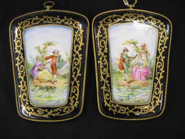 Appraisal: Pair of Porcelain Plaques courting scenes elaborate gold trim approx