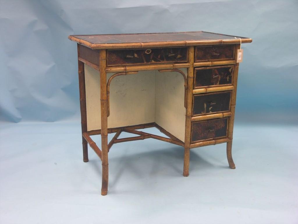 Appraisal: A late Victorian Edwardian bamboo-framed kneehole writing desk top and