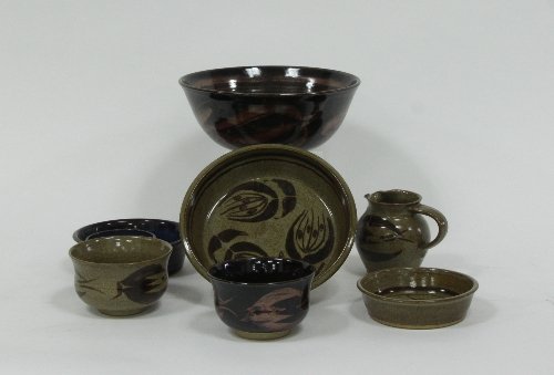 Appraisal: A studio pottery bowl decorated with fruit on a black