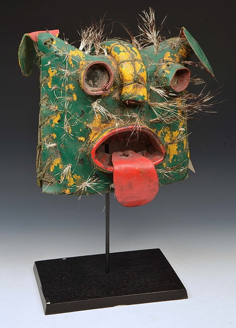 Appraisal: A TIGER HEAD MASK of exaggerated form with painted decoration