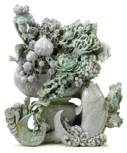 Appraisal: Massive Chinese carved mottled green jadeite groupingCarved from a single