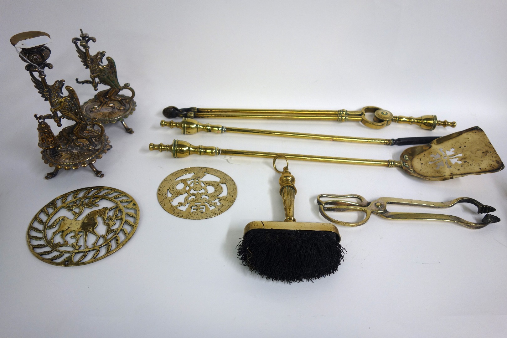 Appraisal: A set of three brass fire tools with turned finials