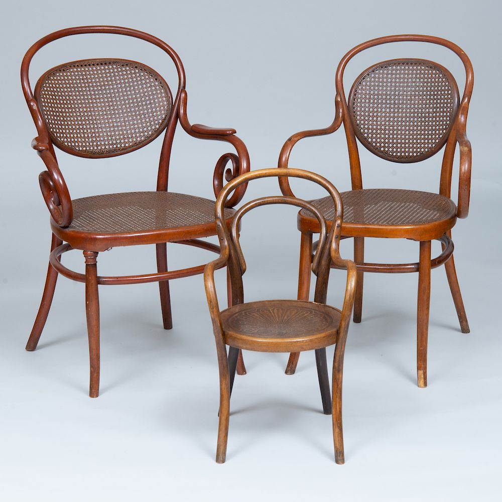 Appraisal: Three Thonet Bentwood Chairs Comprising two armchairs with caned seats