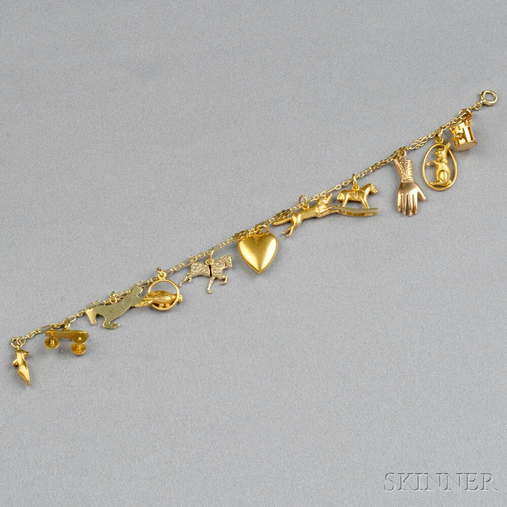 Appraisal: kt Gold Charm Bracelet the eleven charms including a roller