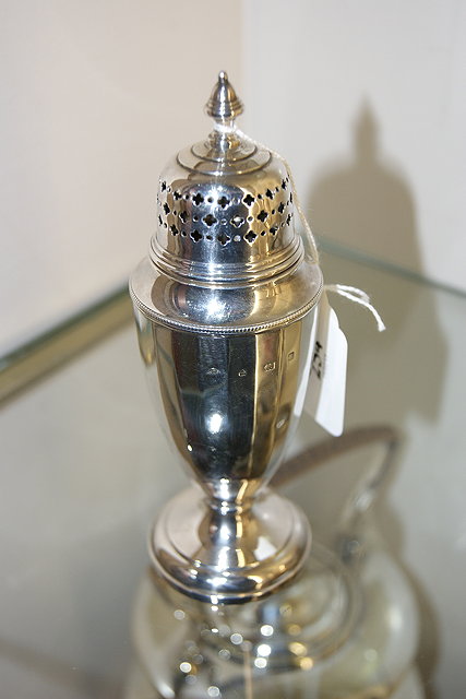 Appraisal: A SILVER CASTER of tapering baluster form on platform base