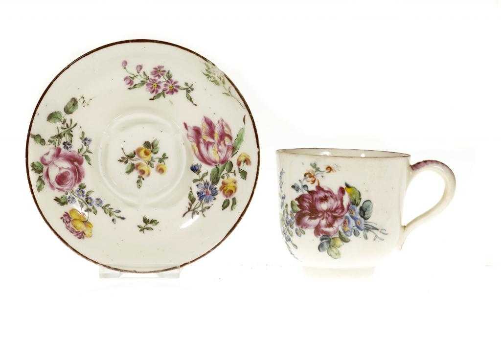 Appraisal: A MENNECY CUP AND TREMBLEUSE SAUCER attractively enamelled with loose