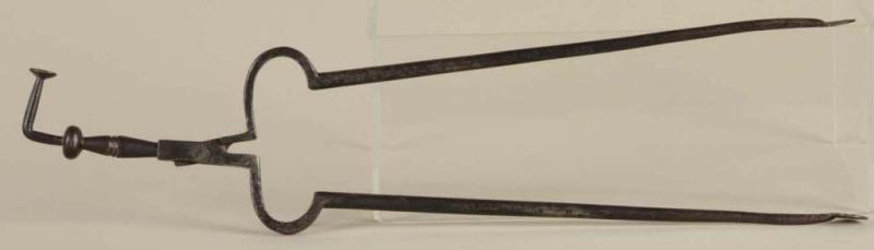 Appraisal: Wrought Iron Pipe Tongs with Tamper Description th Century Box