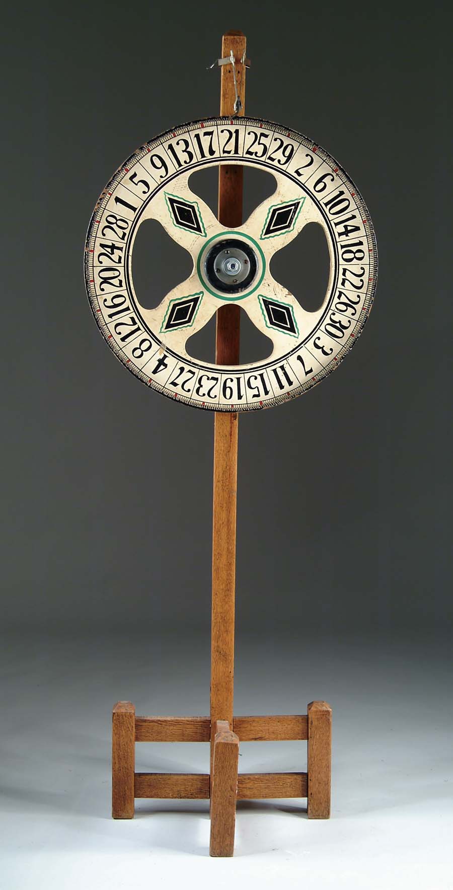 Appraisal: FLOOR MODEL GAMBLING WHEEL Two sided gambling wheel complete with