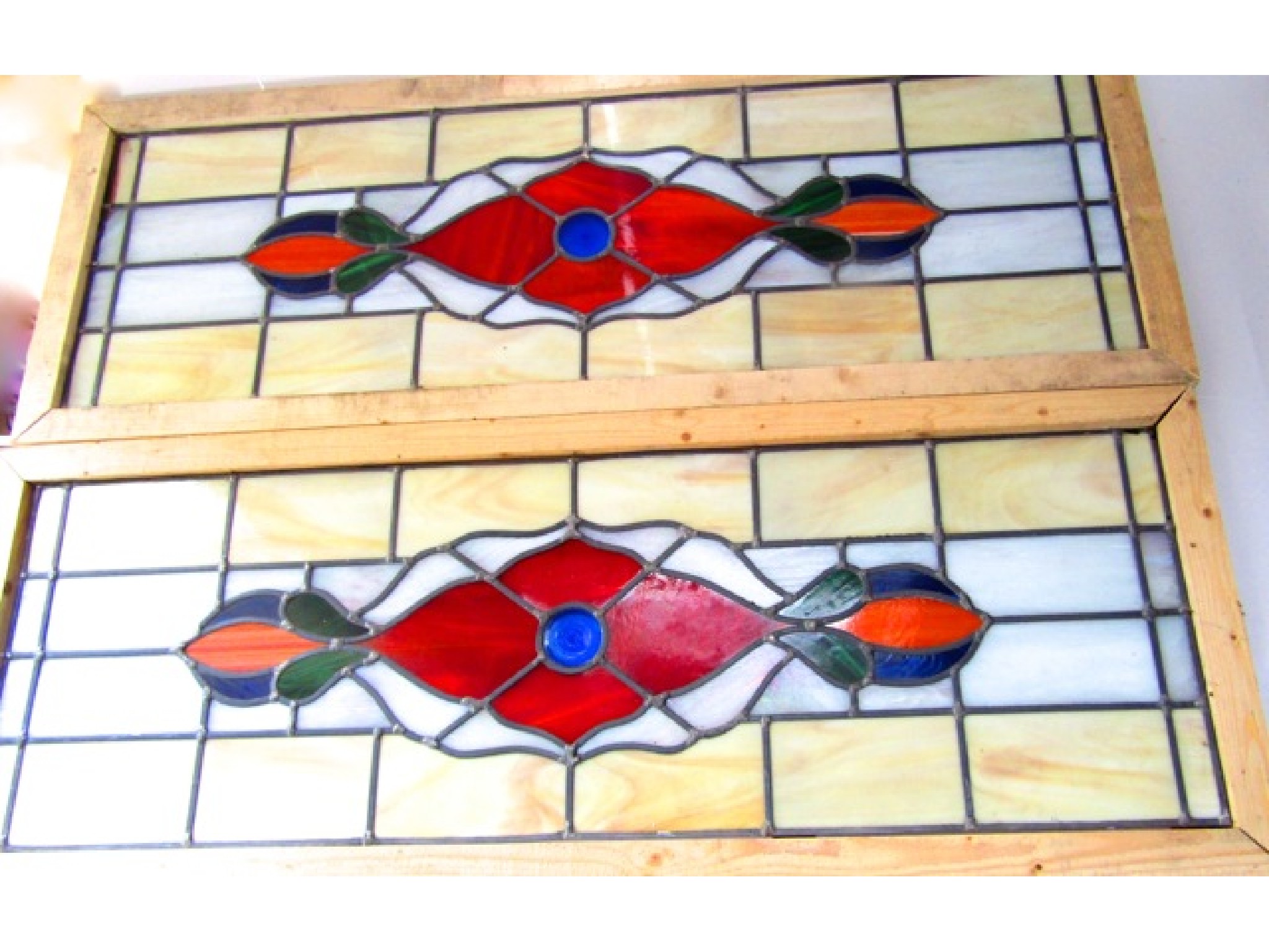 Appraisal: A pair of leaded stained glass panels of rectangular form