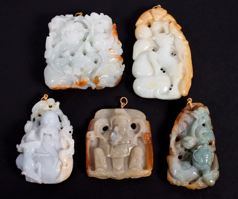 Appraisal: Five Chinese carved jade pendants all with gilt-metal clasps all