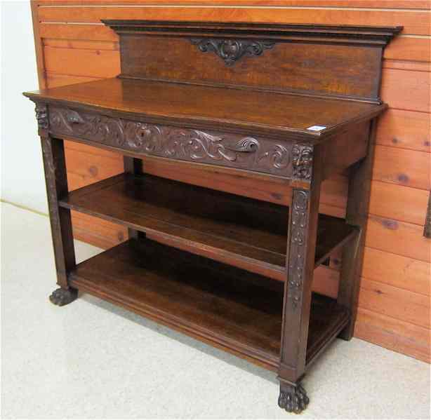 Appraisal: THREE-TIER CARVED OAK SERVING STAND American late th century having