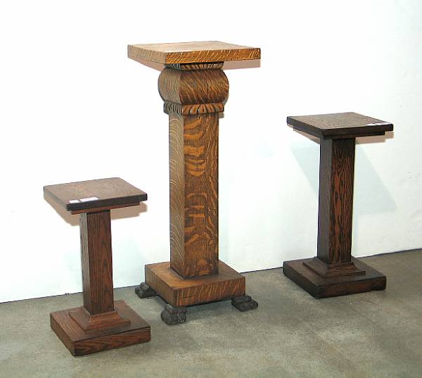 Appraisal: Oak display pedestals Grouping of oak pedestals measuring x and