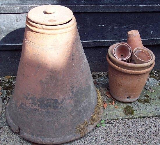 Appraisal: A terracotta rhubarb forcer with lid and sundry terracotta pots