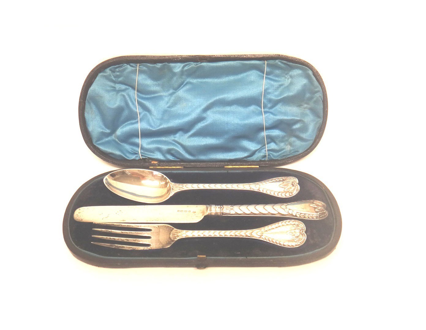 Appraisal: A Victorian silver three piece christening set decorated with foliate